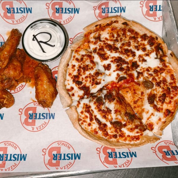 Mister B's Pizza and Wings deep dish pizza, chicken wings, and ranch dressing on branded paper.